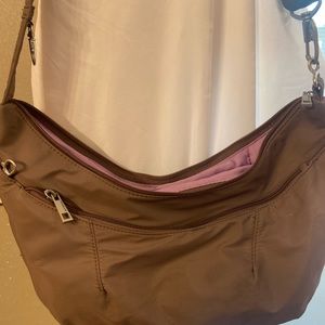 Great condition. Brown with lavender lining